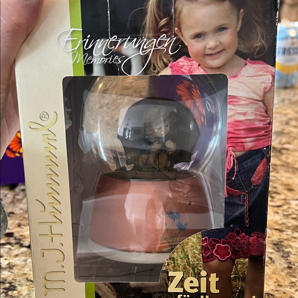M.J. Hummel Snow Globe with Pink Base new in unopened box. Umbrella Girl